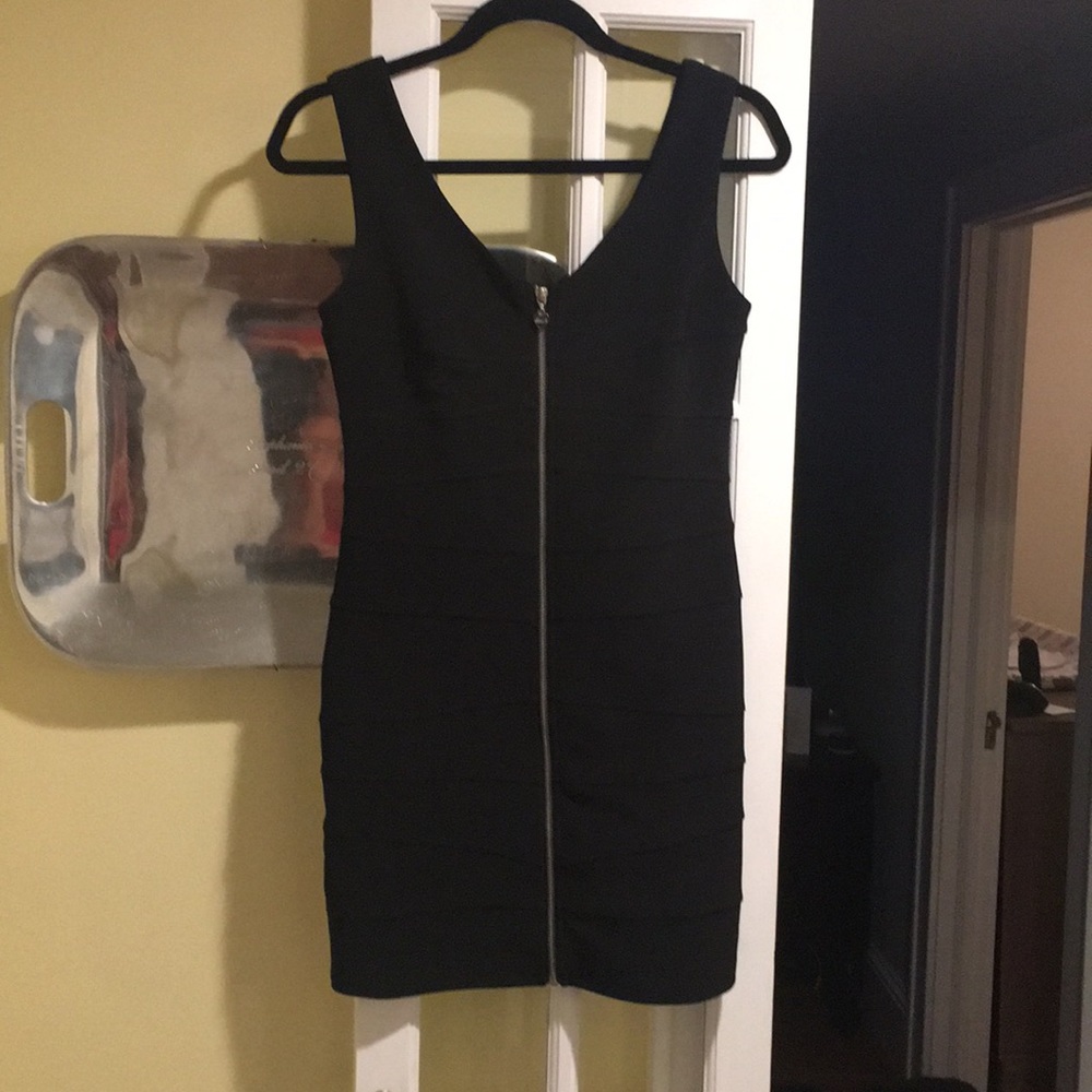 Black mini dress with zipper front.